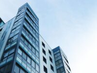 low angle view of office building against sky