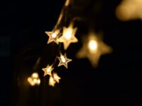 shallow focus photography of yellow star lanterns